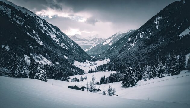 Winter valley landscape with snow covered mountains and pine trees under a dramatic cloudy sky and cinematic bright tones