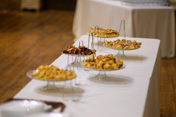 Delicious Assortment of Freshly Baked Fruit Pies Arranged Beautifully on a Buffet Table Ready for a Celebration or Event