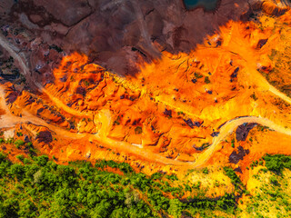 Gant, Hungary, view of the terraces of an old bauxite mine and bauxite formation with red and orange surface. Gánt Bauxitbánya. aerial