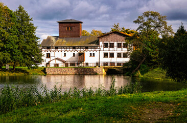 Ancient water mill on the pond. Historic Oliwa district in Gdansk