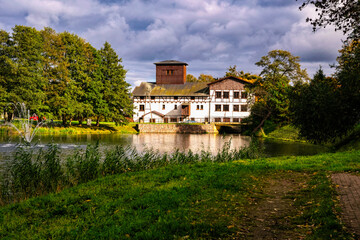 Ancient water mill on the pond. Historic Oliwa district in Gdansk