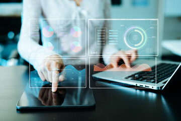 Businessman hand Project manager working and update tasks and Gantt chart scheduling virtual diagram.with smart phone, tablet and laptop in office.