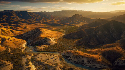 Fototapeta premium Vibrant landscape showcasing rolling hills, valleys, and a winding river during golden hour in a mountainous region