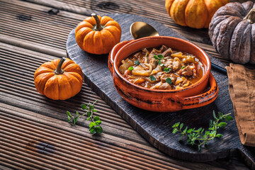 Warm stew with meat, cabbage and pumpkin, comfort autumn dinner balanced food