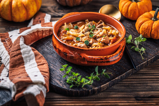 Warm stew with meat, cabbage and pumpkin, comfort autumn dinner balanced food
