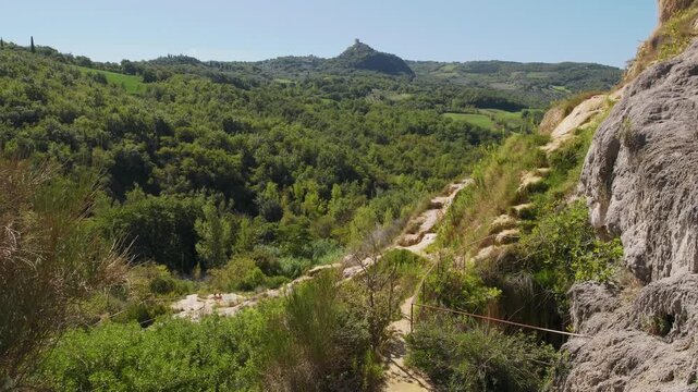 Parco naturale dei Mulini, public park with hot springs and dismantled system of grain mills at Bagno Vignoni, town in the province of Siena, Italy	