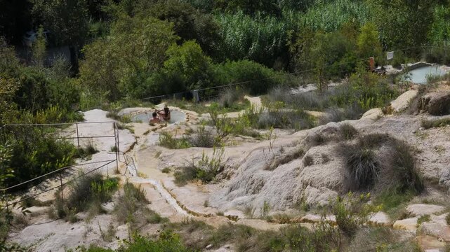 Parco naturale dei Mulini, public park with hot springs and dismantled system of grain mills at Bagno Vignoni, town in the province of Siena, Italy	
