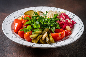Assorted pickled vegetables on white plate