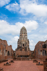 Old ruined buddhist temples and Palace in a green forest park in Ayutthaya landmark, Thailand