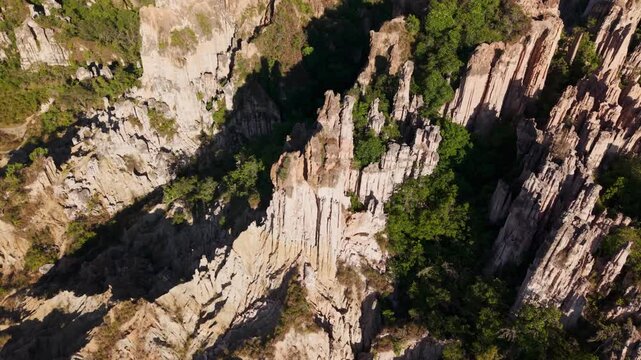 Majestic aerial top view of the rock formations and ravines of los estoraques natural park in colombia