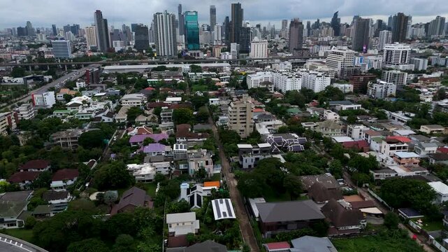 Bang Kapi district in Bangkok, dense residential area with houses and streets. Everyday urban life and modern architecture of Southeast Asian city