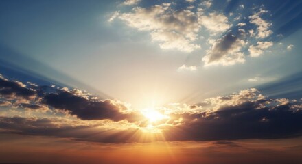 Fototapeta premium Majestic Dawn Breaking Through Clouds with Golden Sun Rays Painting the Horizon in Hues of Orange and Blue Sky