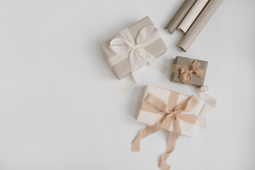 Gift boxes packaging on white background. Festive Christmas, New Year holidays celebration concept. Flat lay, top view