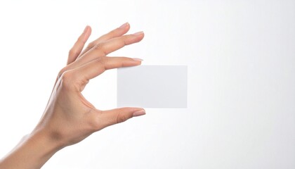 Obraz premium Female hand holding a blank business card or flyer mockup. Isolated on white background