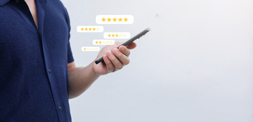 close up young man and hold smartphone and read review online website page about service and experience with many feedback and ranking score from customer for business quality and evaluation concept