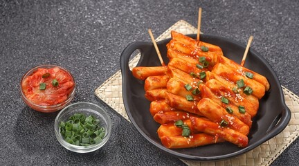 Sotteok so-tteok (소떡소떡), sometimes translated as sausage and rice cake, is a popular South Korean street food consisting of garae-tteok (rice cake) and Vienna sausage skewered and fried