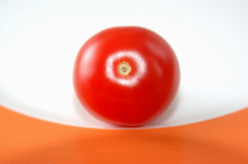 tomato on a white plate