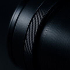 of Smooth Cold Dark Metal Barrel of HighTech Camera Lens Showing Precise Ring Texture