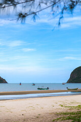 Vertical Seascape with Small Boats and Framing Branches