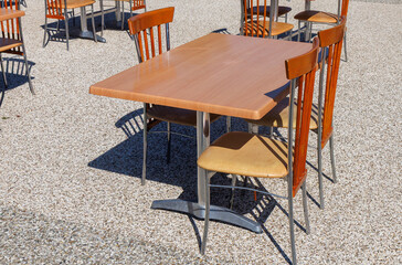 A wooden table with four chairs around it