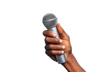 Hand holding a microphone against black background
