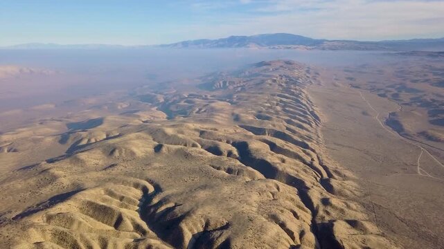  drone footage showing the dramatic Temblor Range in the Carrizo Plain National Monument, California. The video captures the striking folds, ridges, and fault lines carved by the San Andreas Fault.