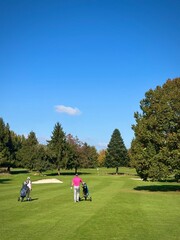 family walking on the golf course