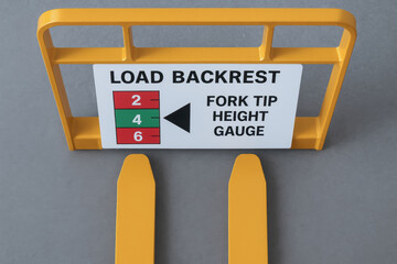 Load backrest fork tip height gauge sign yellow pallet fork promoting accident prevention and workplace safety with clear instruction and bold