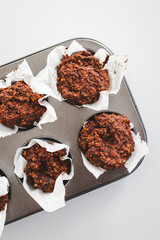 healthy cocoa baked oats cups in muffin tray, healthy breakfast or snack