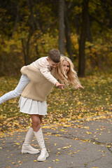 Fototapeta premium mother and son playing in the autumn park