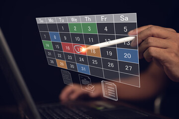 Businessman uses a stylus on a virtual calendar to schedule an appointment or mark a deadline. The interface represents event planning, task management, and digital organization for productivity.