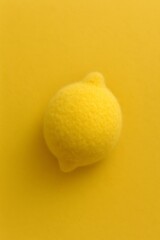 Vibrant yellow lemon on a matching sunny background, offering a fresh and cheerful summery vibe perfect for vibrant marketing or creative projects