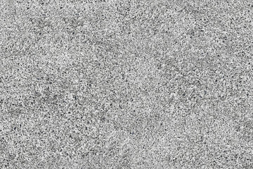Texture of gray concrete with a rough, freckled surface. This detailed background is suitable for digital design, architectural rendering, and industrial themes.