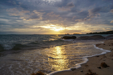 Panoramic blur sunset beach landscape in Thailand. Inspire tropical beach seascape horizon. Sunset sky calmness tranquil relaxing sunlight. Tropical beach at sunset, light sand, and a blurred horizon.