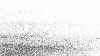 A gradient of gray dots on a white background with varying density.