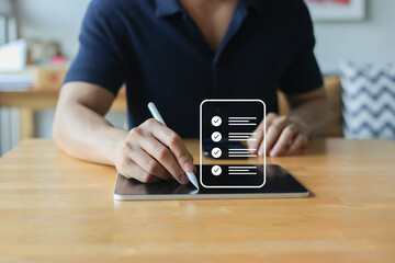 close up businessman hand use stylus to check online questionnaire survey from website to rate score and share aspect of audience after complete from seminar for business corporation concept