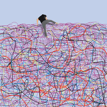 Person climbing over tangled obstacle representing achievement