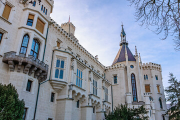 Historic european castle with turrets and windows under blue sky