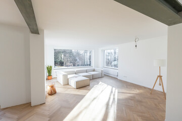 Minimalist living room under construction with lots of sunlight.