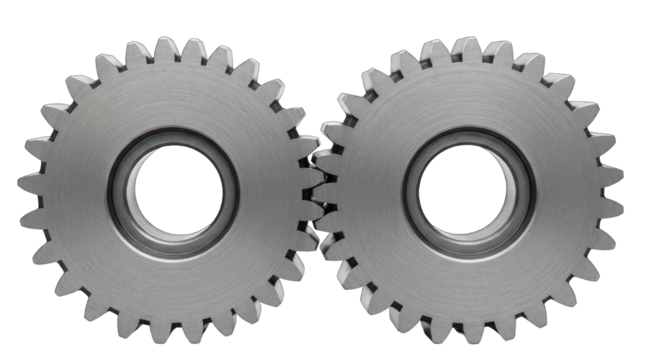 Two interlocking metal gears, viewed close, on a dark background