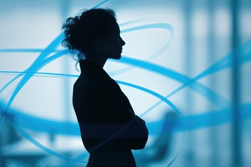 Silhouette of business woman standing confidently in modern office with abstract digital blue light trails