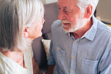 Senior couple spending quality time together at home, sharing a tender and loving moment that reflects affection, companionship, and a healthy, peaceful retired lifestyle