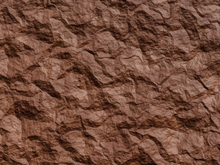 Detailed close-up of a rough, crinkled brown rock texture with intricate patterns.