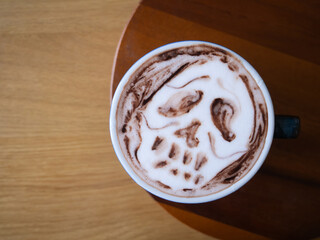 coffee latte art brown white cappuccino drink cup hot beverage espresso milk foam cafe breakfast caffeine barista design halloween sugar skull dead horror death wooden table background selected focus
