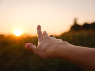 Warm sunset hues create peaceful, dreamy countryside atmosphere.