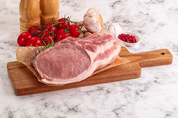 Raw potk loin steak with bone