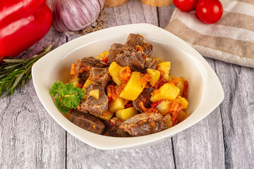 Rogout with meat, potato and tomatoes