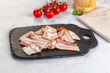 Raw pork tenferloin with bacon