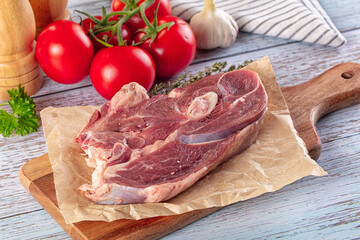 Raw lamb steak with bone