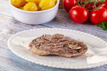 Grilled lamb steak with bone